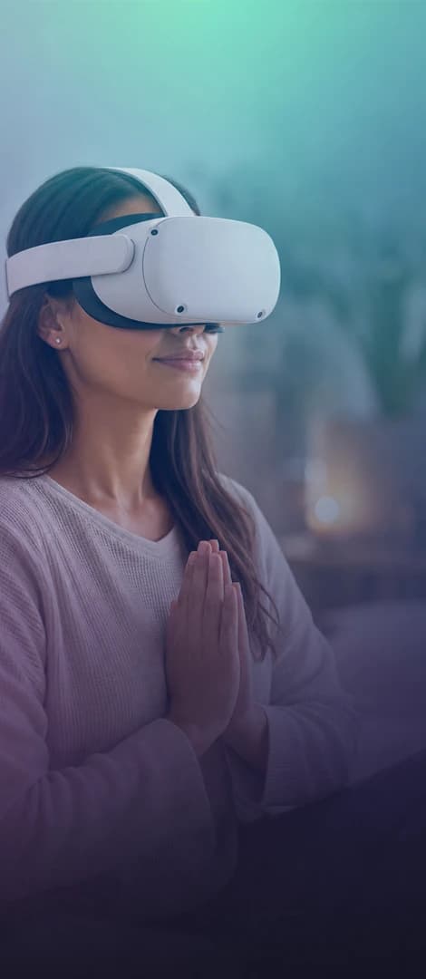 Woman meditating with a white VR headset